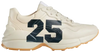 Gucci women’s Rhyton ‘25 - Ivory’ sneaker in sustainable Demetra leather with chunky cream sole and minimalist branding.

