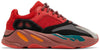Yeezy Boost 700 ‘Hi-Res Red’ sneaker with red mesh and suede upper, maroon Boost midsole, and multicolor accents.