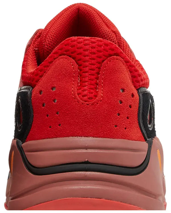 Yeezy Boost 700 ‘Hi-Res Red’ sneaker with red mesh and suede upper, maroon Boost midsole, and multicolor accents.