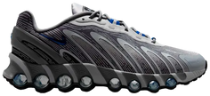 Better Gift Shop x Nike Air Max DN8 'Revenge' 2025 sneaker with grey mesh upper, reflective overlays, blue mini-Swoosh, and exposed Air tube cushioning.

